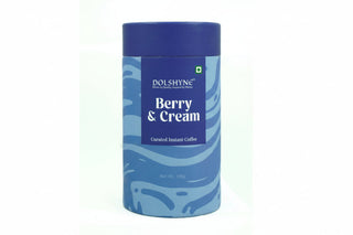 Blue container of Dolshyne Berry & Cream instant coffee on a white background